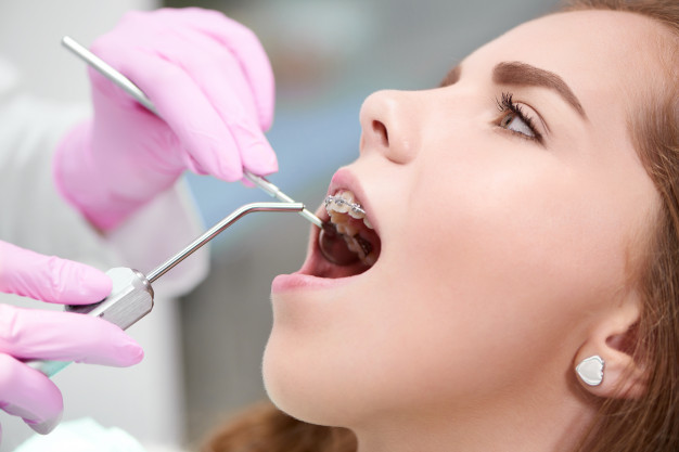 young-woman-dentist-office_7502-5725